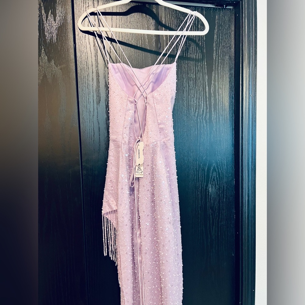 Size 4/6 light lavender prom dress with string bead work. NWT